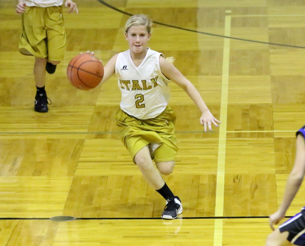 Image: Guard Karson Holley(2) makes a quick transition from defense to offense for Italy.