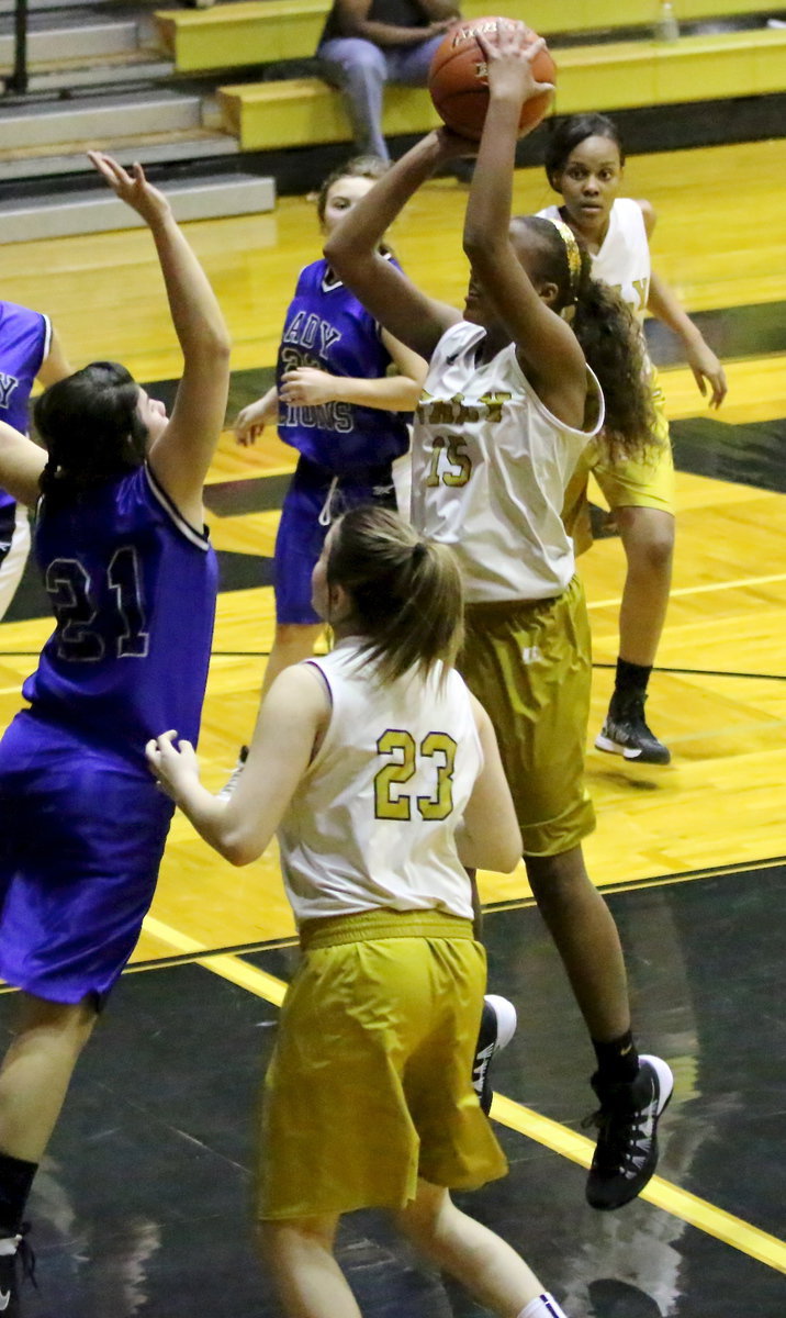 Image: Emmy Cunningham(15) pulls up over a Blooming Grove defender.