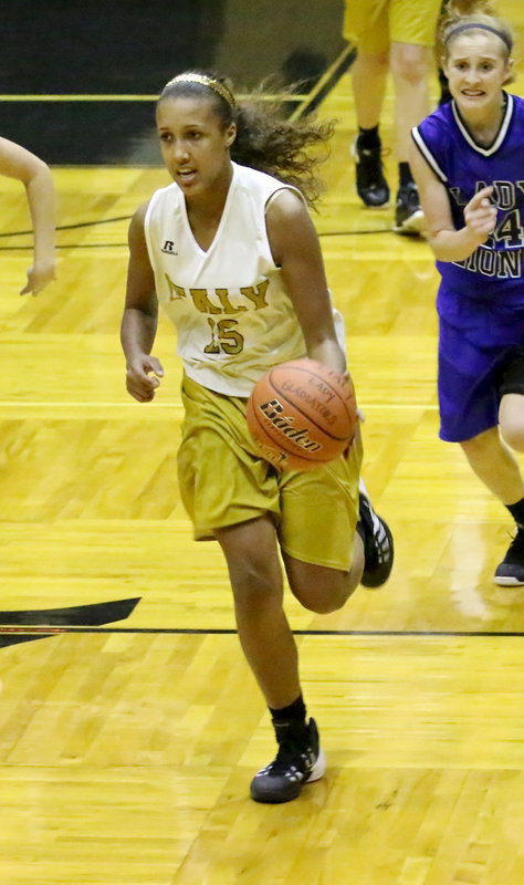 Image: Emmy Cunningham(15) races to the basket.