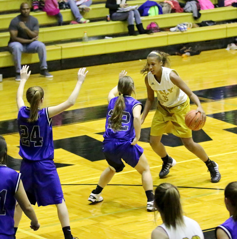 Image: Displaying her ball handling skills is Emmy Cunningham(15) as she searches for a crease.