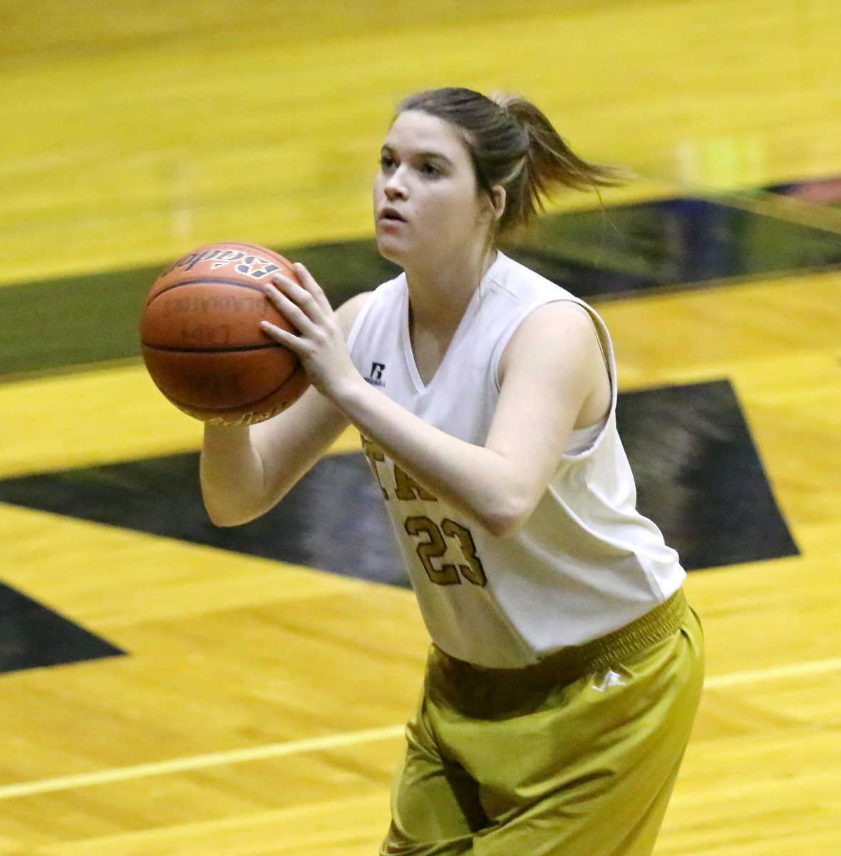 Image: Italy 8th grader Grace Haight(23) practices a jumper before her team’s game.