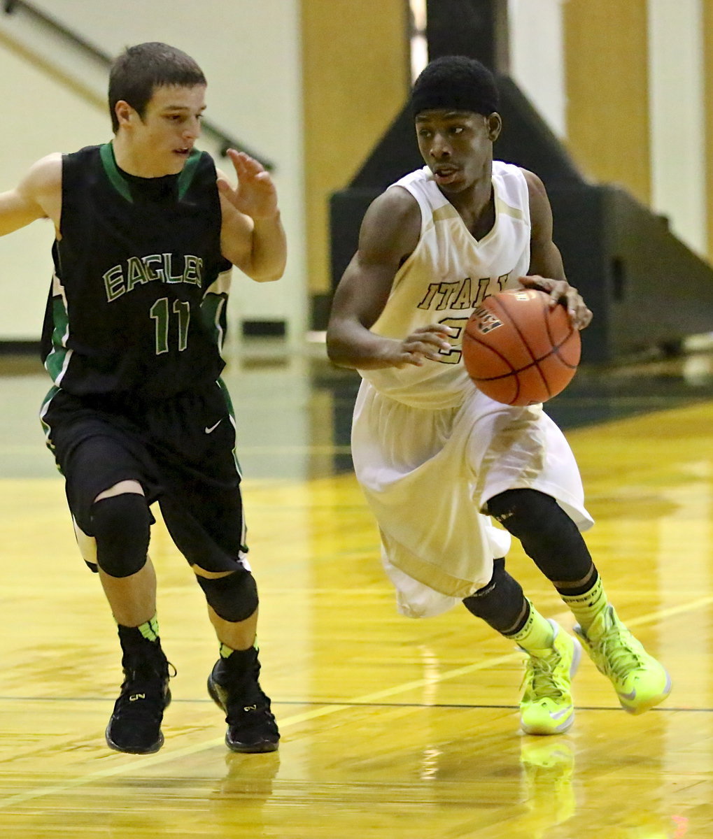 Image: Eric Carson(2) drives past an Eagle defender on the way to the hoop but Rio Vista holds off a comeback effort by Italy’s JV team to win 32-30.