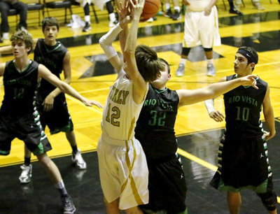 Image: Ty Windham(12) draws a shooting foul from an Eagle defender.