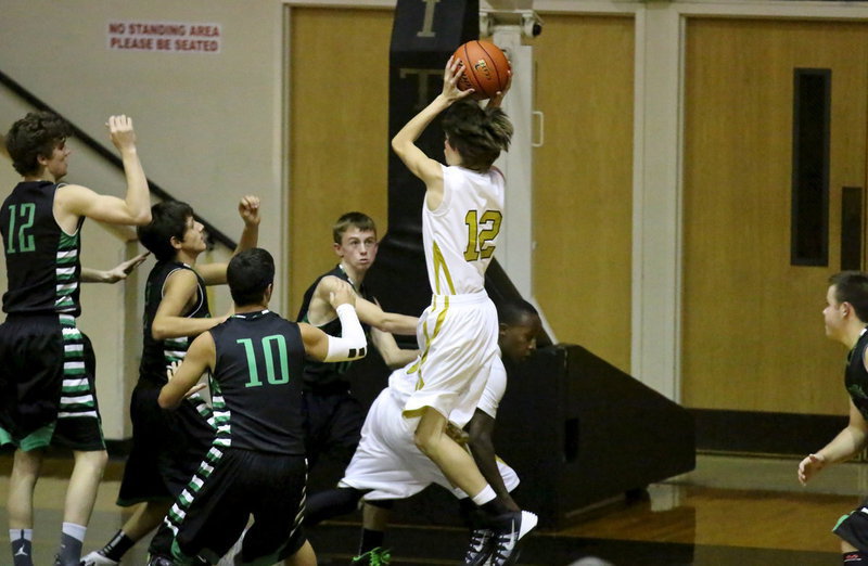 Image: Ty Windham(12) putting on an aerial display to grab a defensive board for the Gladiators.