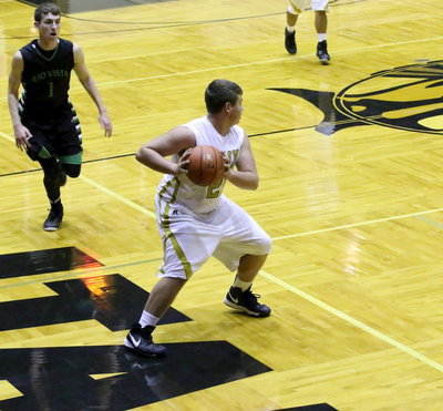 Image: Zain Byers(21) secures the ball while helping to break Rio Vista’s press defense.