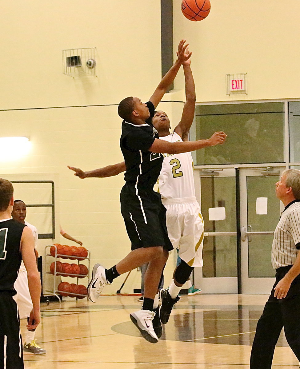 Image: Italy squares off against Rappaport in round-one of the Hubbard basketball tournament with senior Trevon Robertson(2) getting the action started for Gladiators.