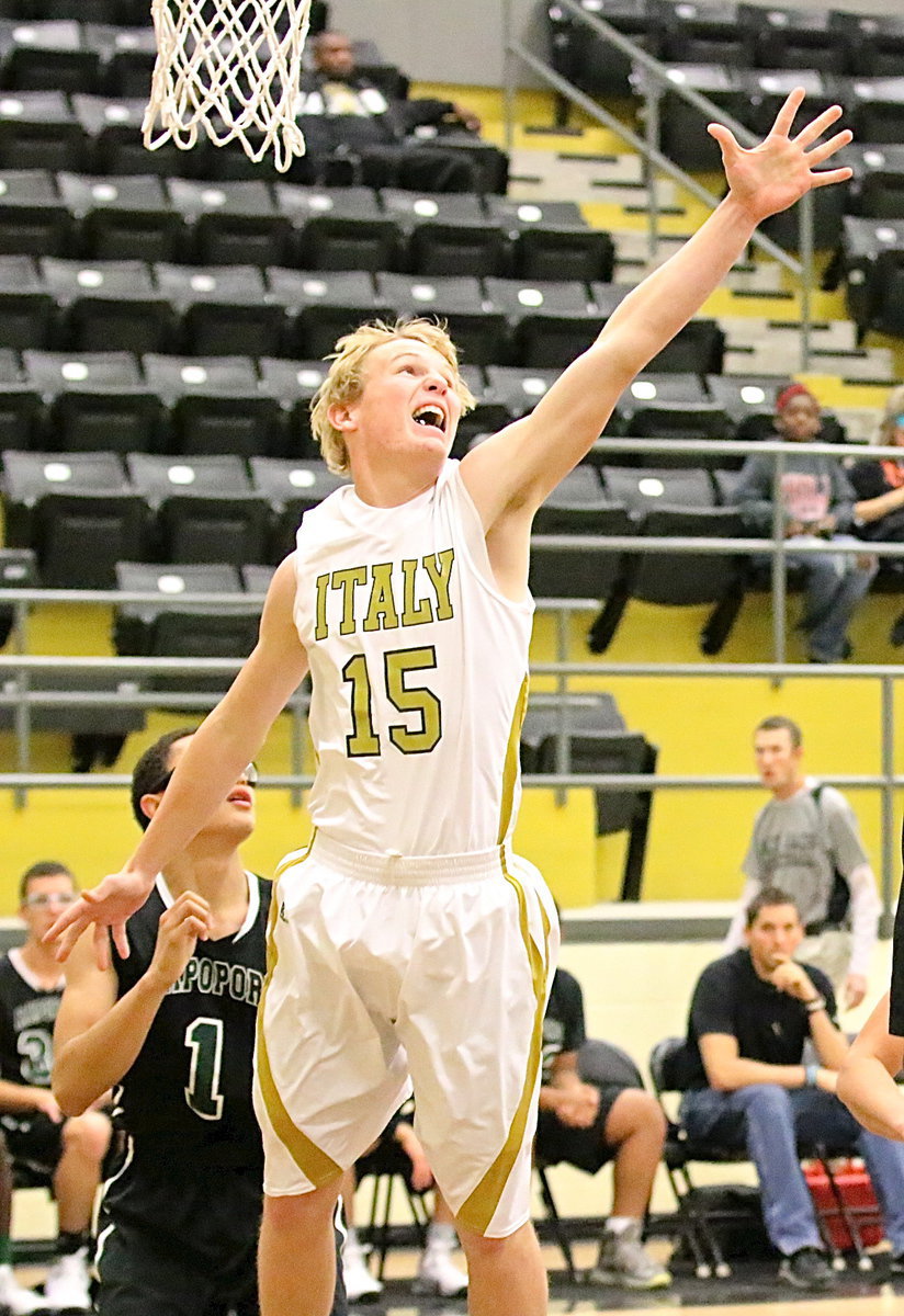 Image: Gladiator junior Cody Boyd(15) defends the basket against Rappaport.