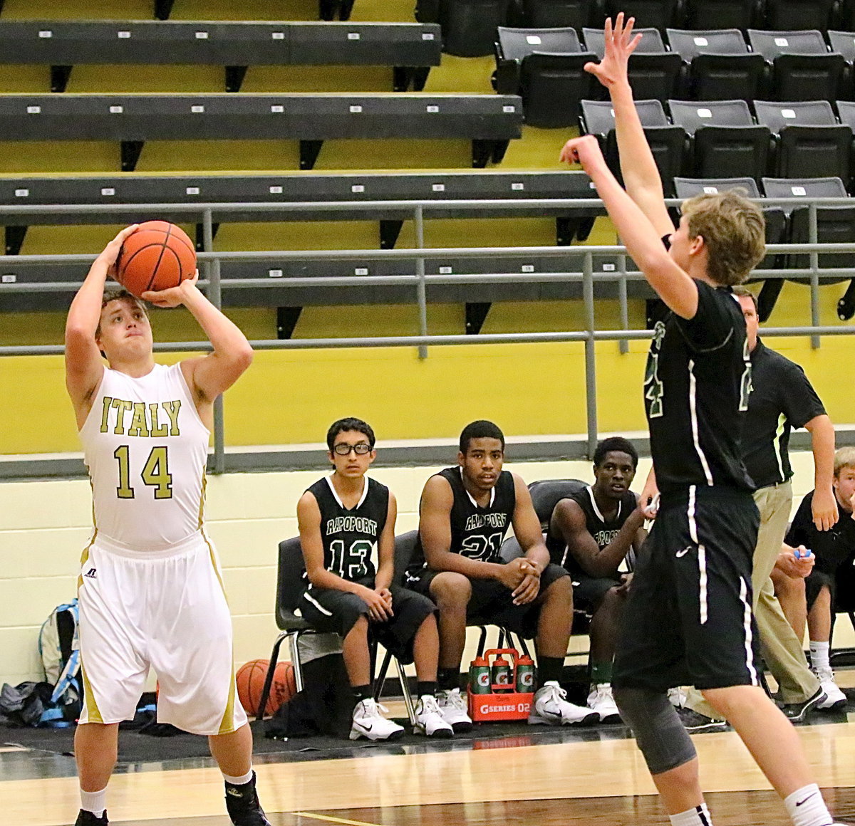 Image: Italy senior Bailey Walton(15) tries a three-pointer from the corner.