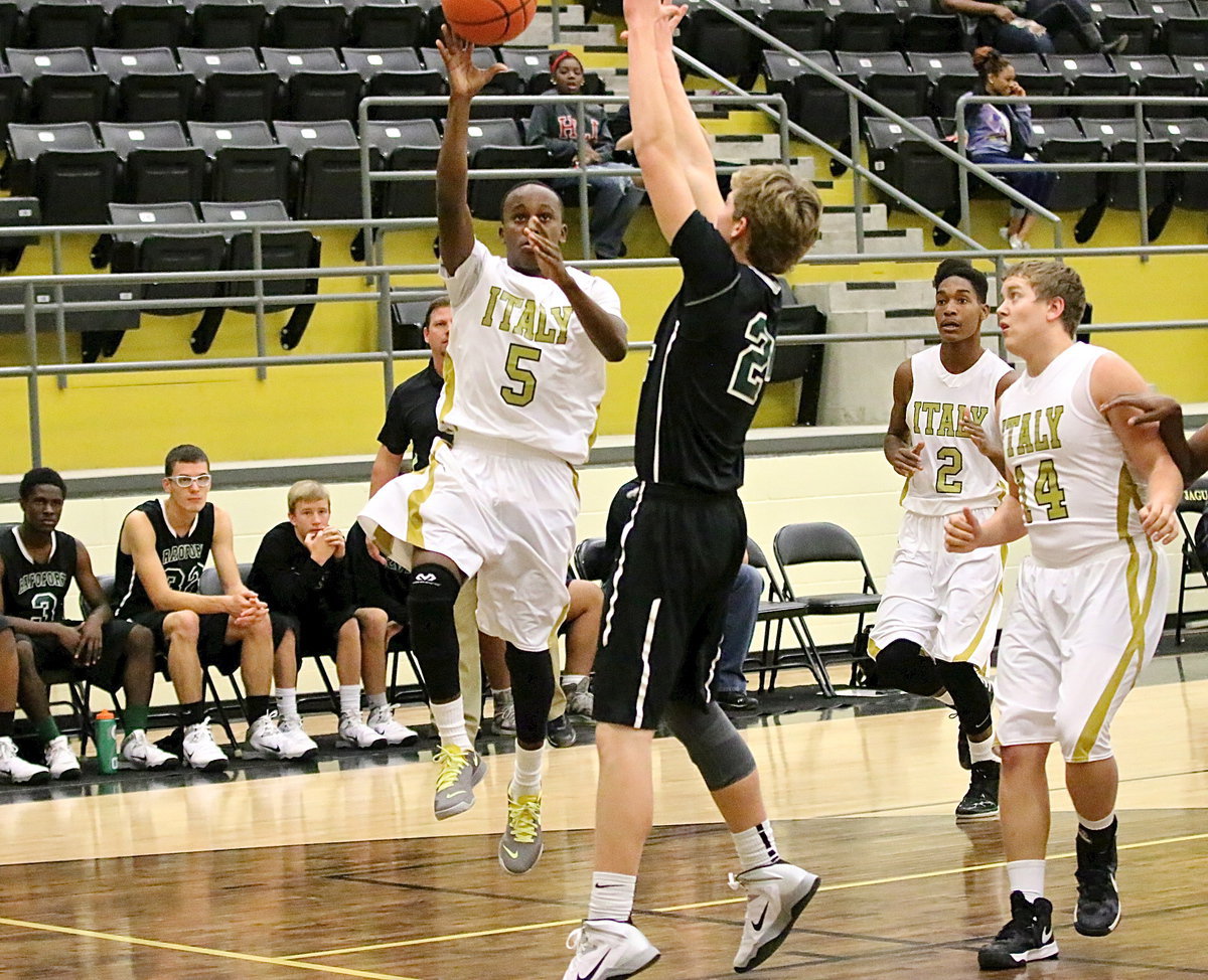 Image: Putting up a shot for Italy is Kevin Johnson(5).