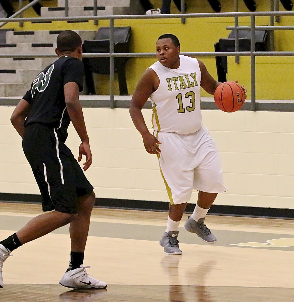 Image: Senior Gladiator Darol Mayberry(13) brings the ball across half-court.