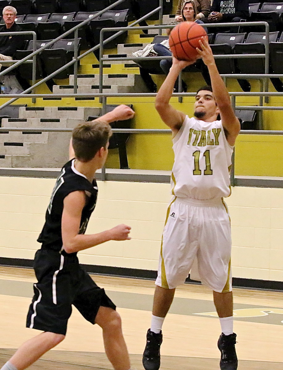 Image: Gladiator senior Tyler Anderson(11) takes a jumper.