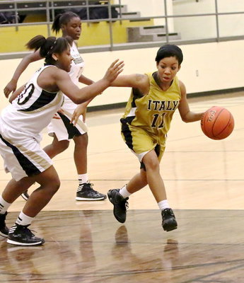 Image: Ryisha Copeland(11) searches for an opening thru a wall of Hubbard defenders.