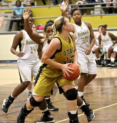Image: Making a move toward the basket is center Jaclynn Lewis(13).