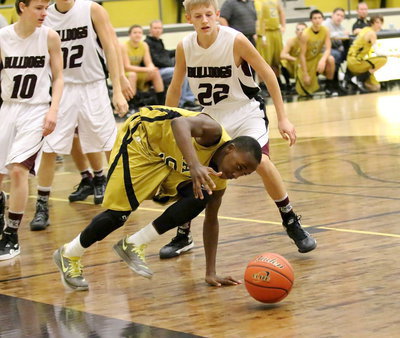 Image: Kevin Johnson(5) uses his athleticism to keep the ball in bounds.