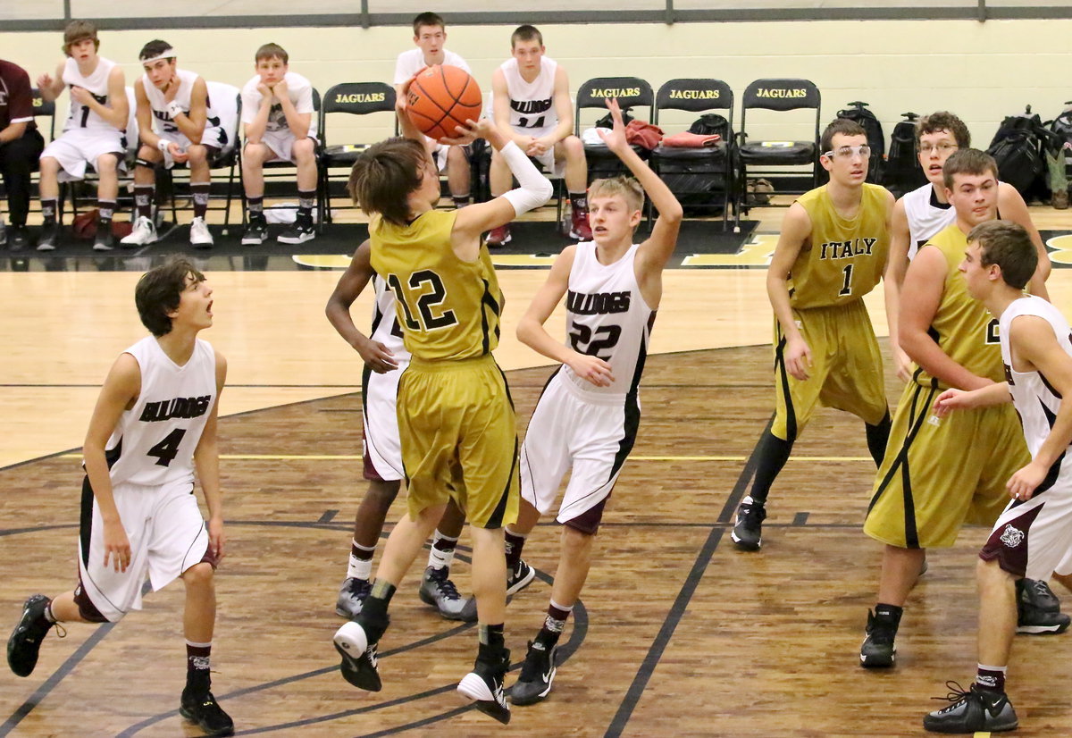 Image: Italy’s Ty Windham(12) shoots a mid-range jumper.