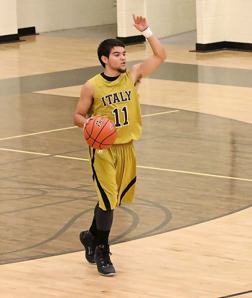 Image: Point guard Tyler Anderson(11) calls the offensive plays for the Gladiators.