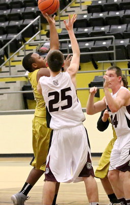 Image: Darol Mayberry(13) gets into the paint for a bucket.