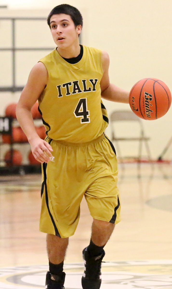 Image: Mason Womack(4) brings the ball up the court.