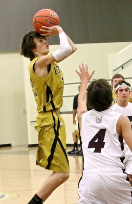 Image: Ty Windham(12) takes jumper from the elbow.