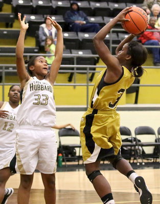 Image: Kortnei Johnson(3) takes her game to the Lady Jag defense.