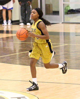 Image: With the seconds ticking down, K’Breona Davis(12) rushes the ball up the court.