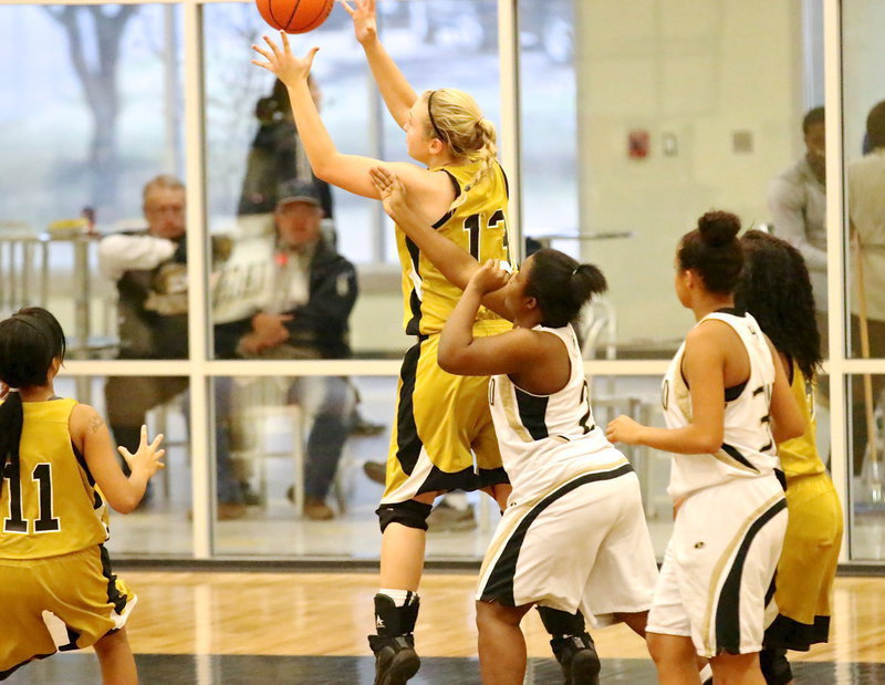 Image: Jaclynn Lewis(13) grabs a defensive rebound.