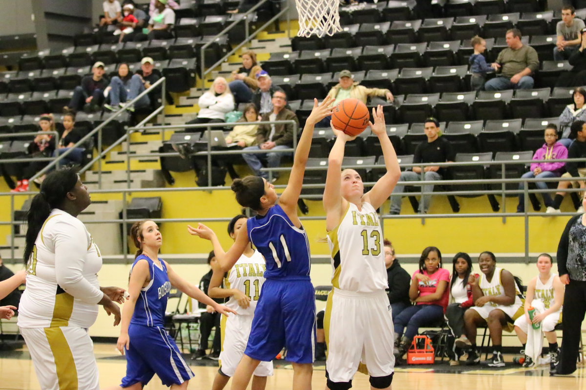 Image: Jaclynn Lewis(13) scores under the basket for the Lady Gladiators.