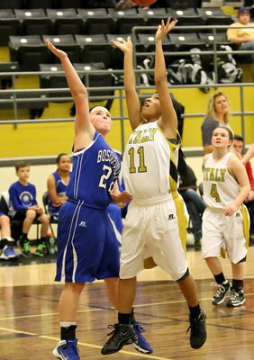Image: Ryisha Copeland(11) puts up a shot under the basket.