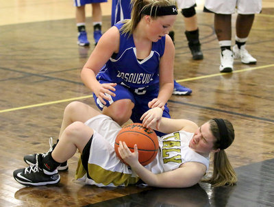 Image: Lady Gladiator Tara Wallis(4) gets dinged up after diving for a loose ball.
