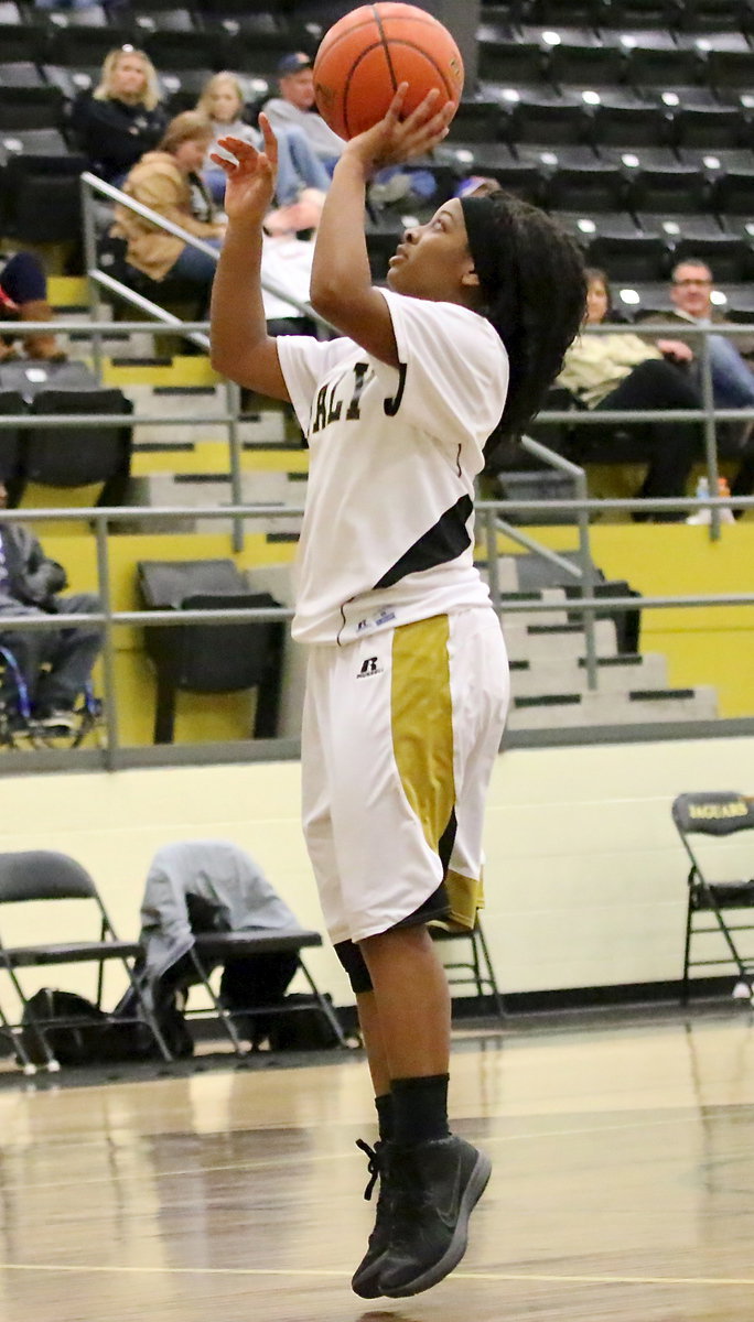 Image: Bernice Hailey(2) practices a layup before the Bosqueville game.