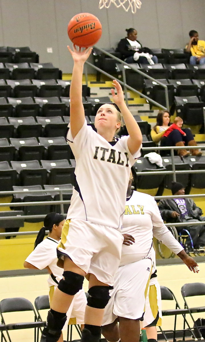 Image: Jaclynn Lewis(13) practices a layup before the Bosqueville game.