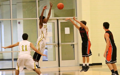 Image: Tyler Anderson(11) and Trevon Robertson(2) keep pressure on Centerville’s long-ball shooters.