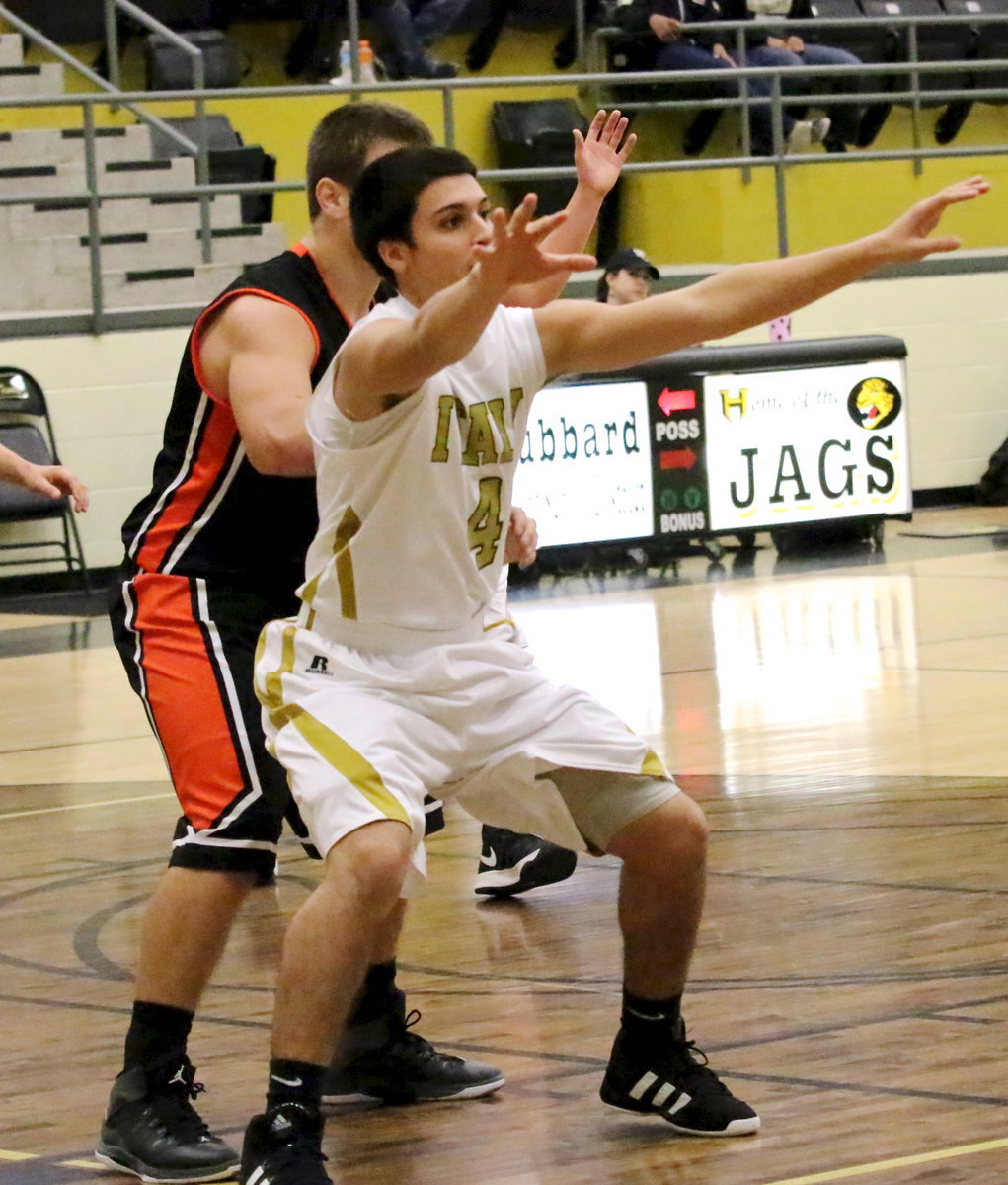 Image: Mason Womack(4) posts up on the low block.