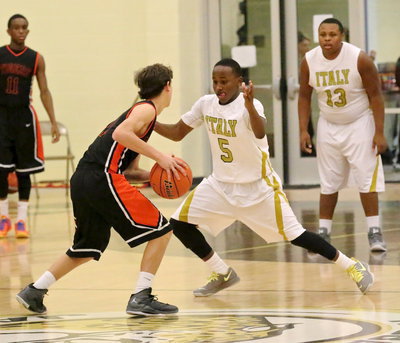Image: Kevin Johnson(5) pressures the Tigers’ point guard.