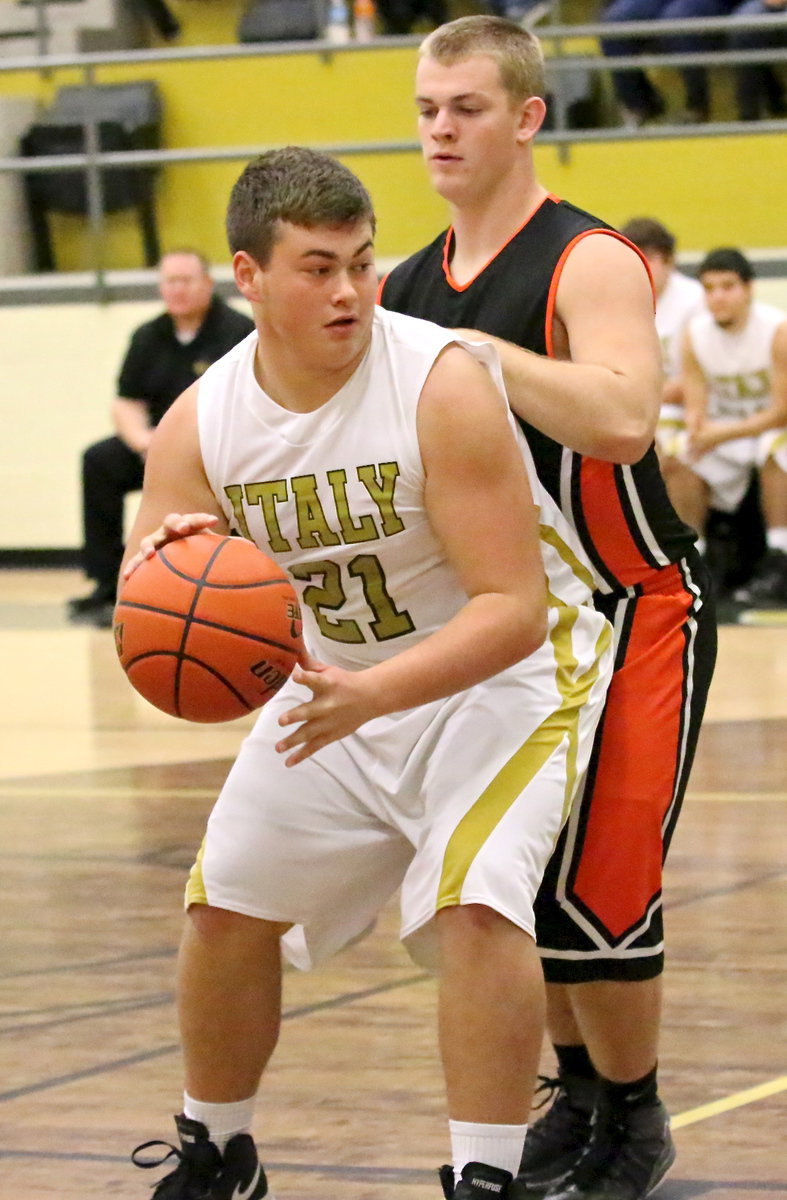 Image: Center Zain Byers(21) tries to work the low block.