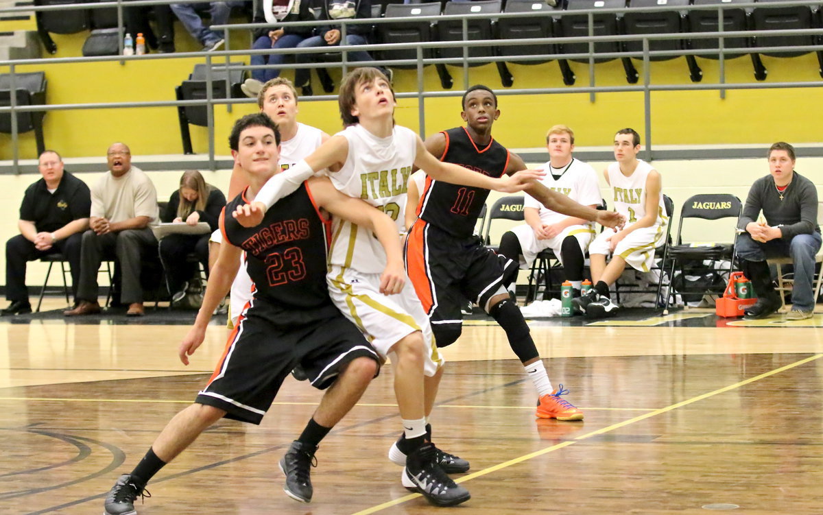 Image: Ty Windham(12) attempts to gain inside position on the offensive boards.