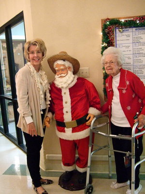 Image: Isn’t Santa lucky surrounded by two lovely ladies.