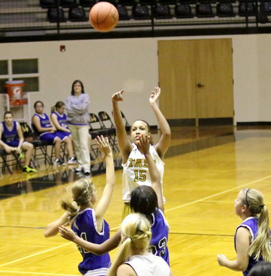 Image: Emmy Cunningham(15) pulls up to knock down a jumper over the Venus defense.