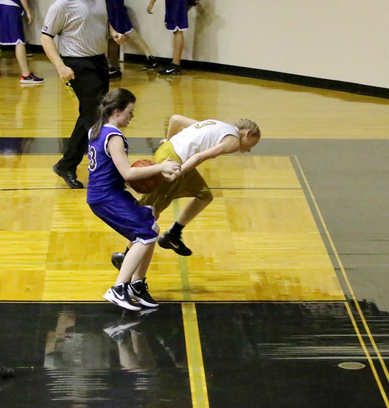 Image: Taylor Boyd(3) saves the ball from going out-of-bounds causing a Venus player to knock the ball out.