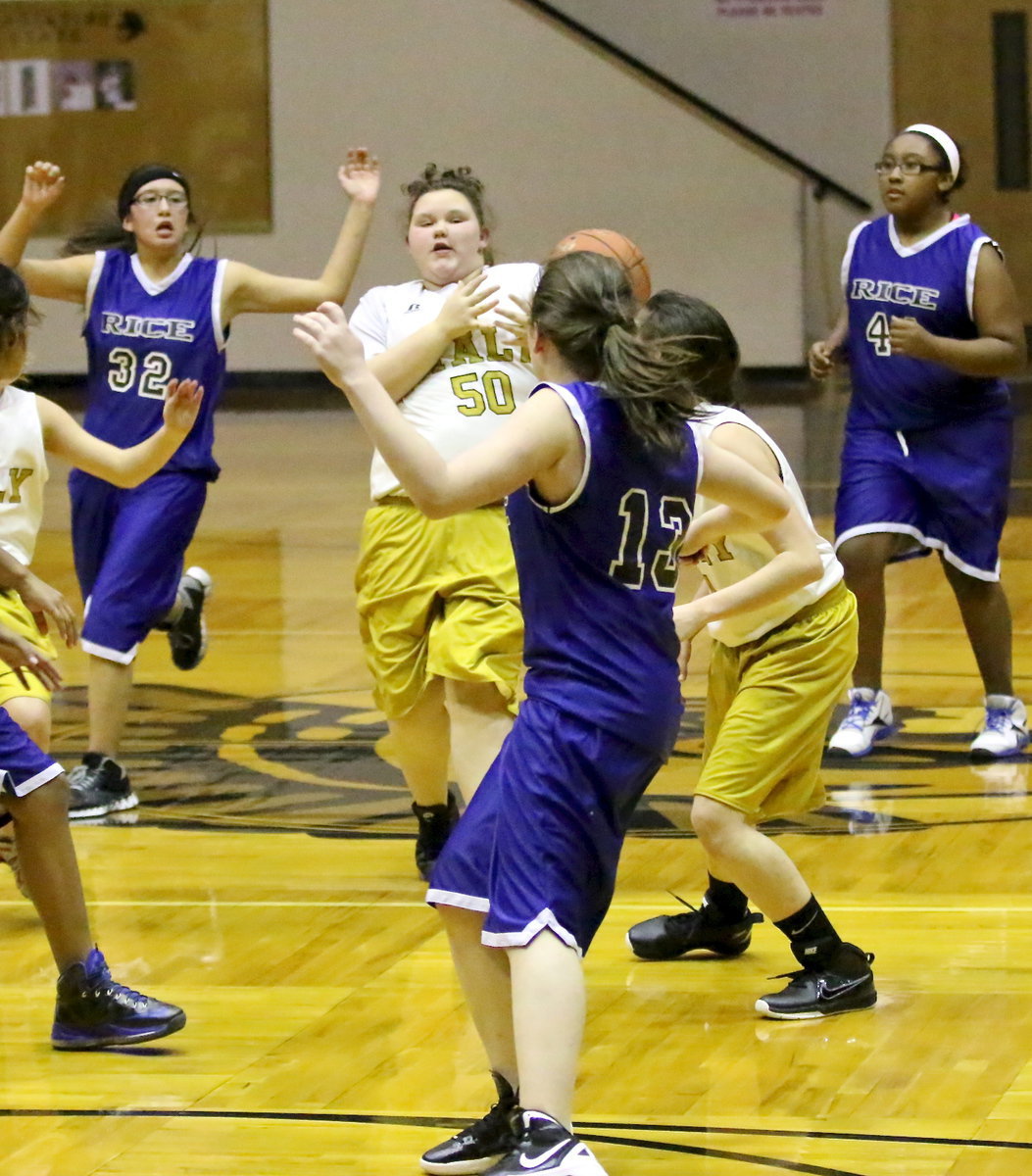 Image: Hot potato! Virginia Stephens(50) tries to get a handle on the ball.