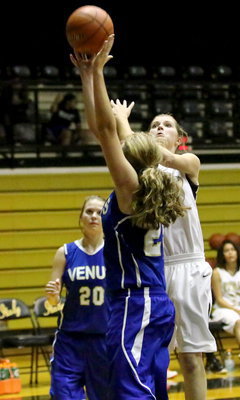 Image: Halee Turner(3) puts in a shot from under the basket.