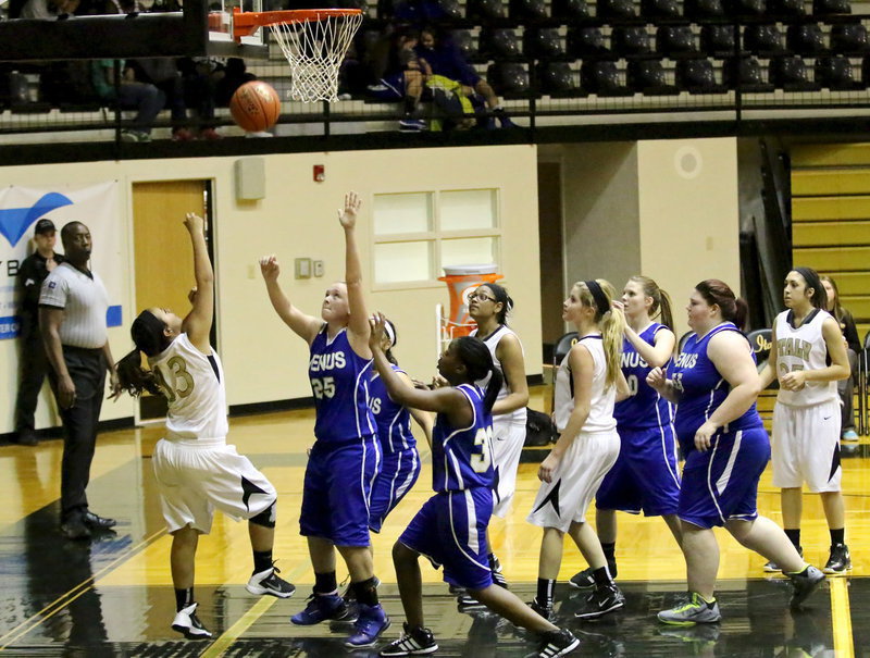 Image: Italy’s Ashlyn Jacinto(13) gets the shot up after grabbing an offensive rebound.