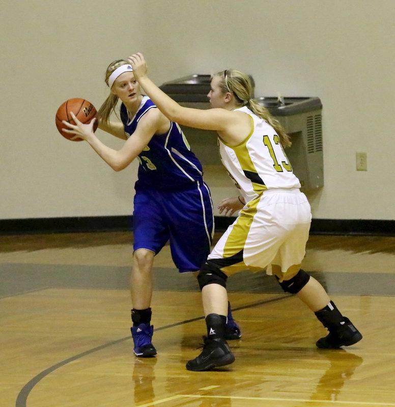 Image: Jaclynn Lewis(13) closes out on a Venus shooter and forces the Lady Bulldog to pass.