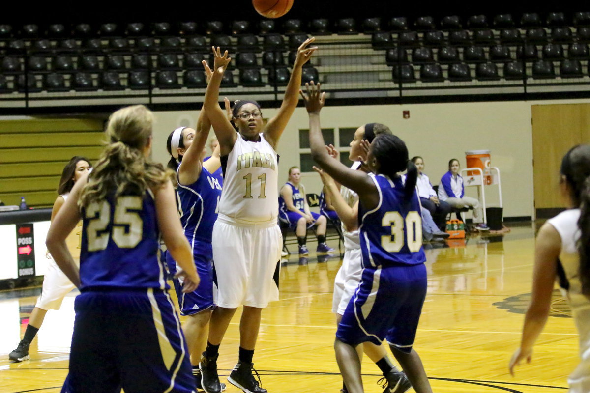 Image: Oleshia Anderson(12) passes over to teammate Ashlyn Jacinto.