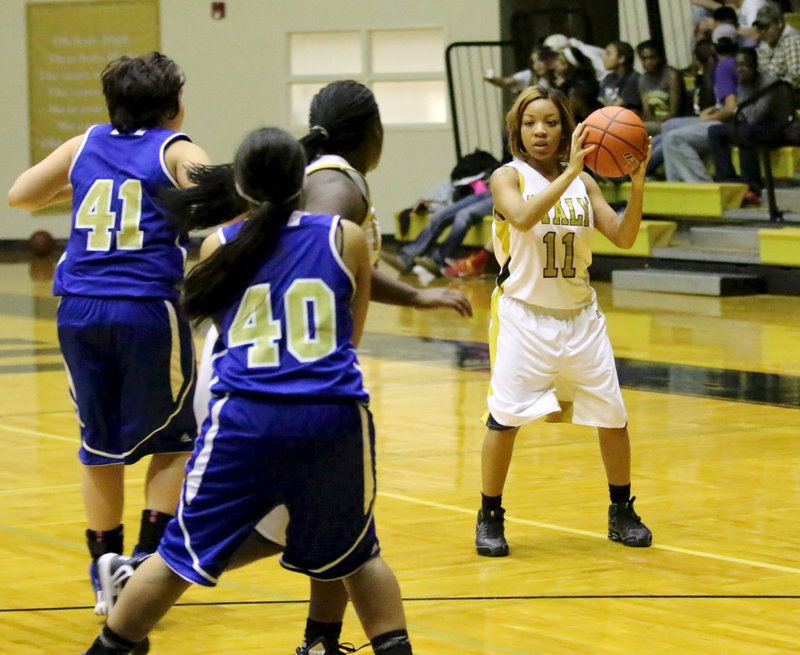 Image: Ryisha Coplead(11) wants to pass the ball in to post player Taleyia Wilson(11).