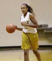 Image: Emmy Cunningham(15) keeps her eyes up while bringing the ball up court.