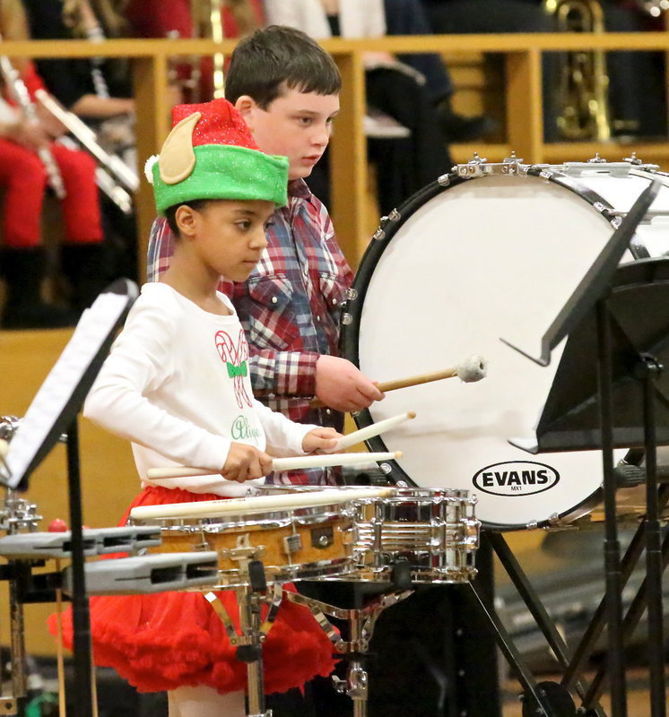 Image: 6th graders Aliyah Turner and Hunter Hinz help get the 2013 Italy Christmas Concert underway.