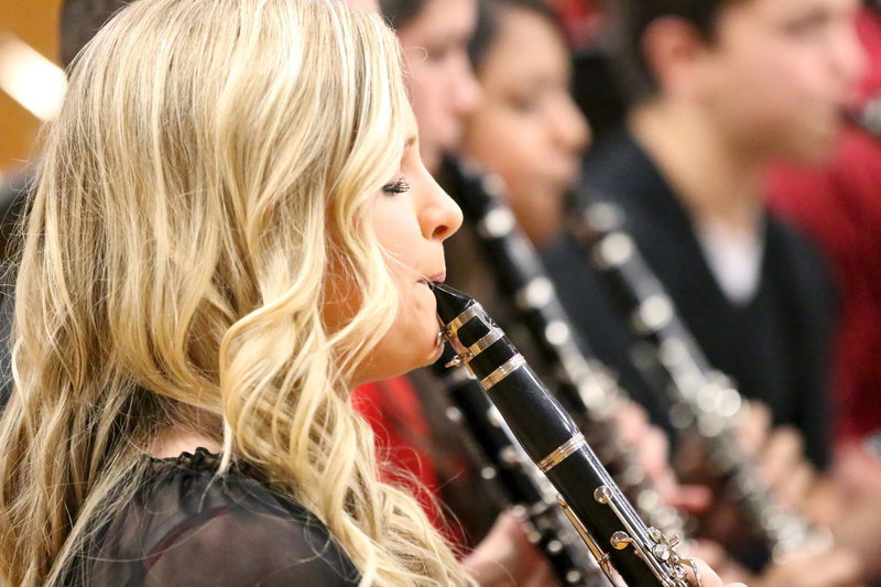 Image: Annie Perry is in sync with her row of fellow clarinetists.