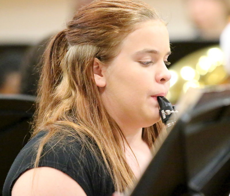 Image: Christy Murray helps with the holiday harmony on her clarinet.