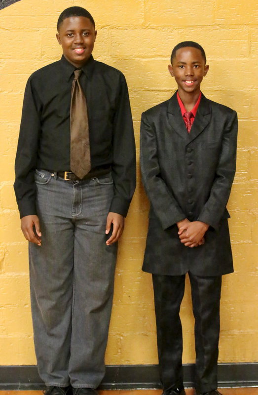 Image: Anthony Lusk, Jr. and Jaylon Lusk pose for family members after the concert.